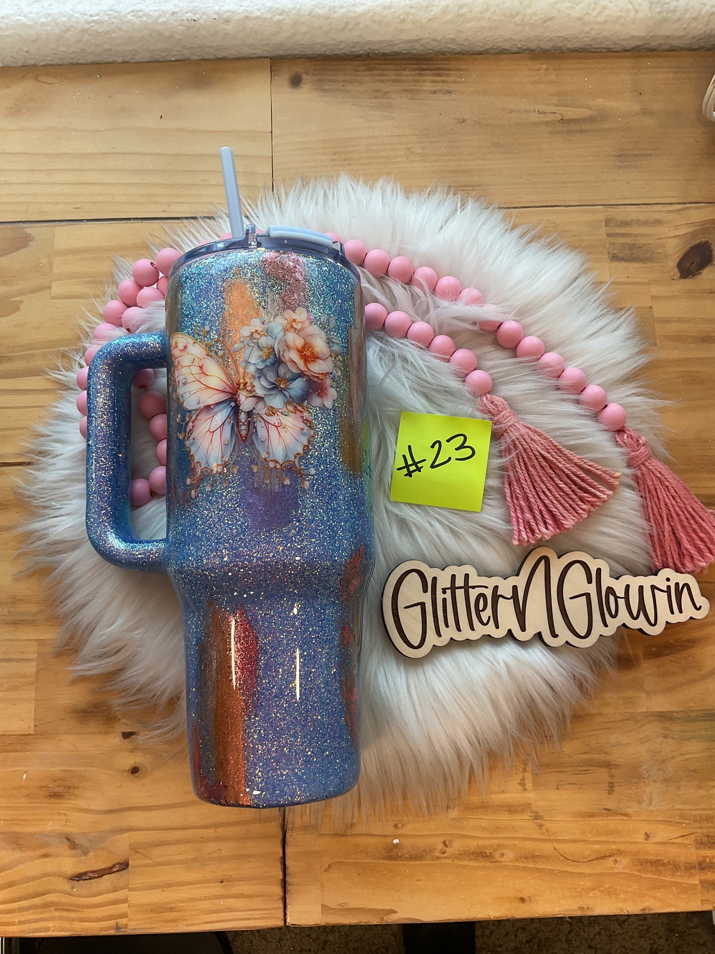 23.   40oz Blue Flipstraw – Periwinkle glitter, foils w/ butterfly decal